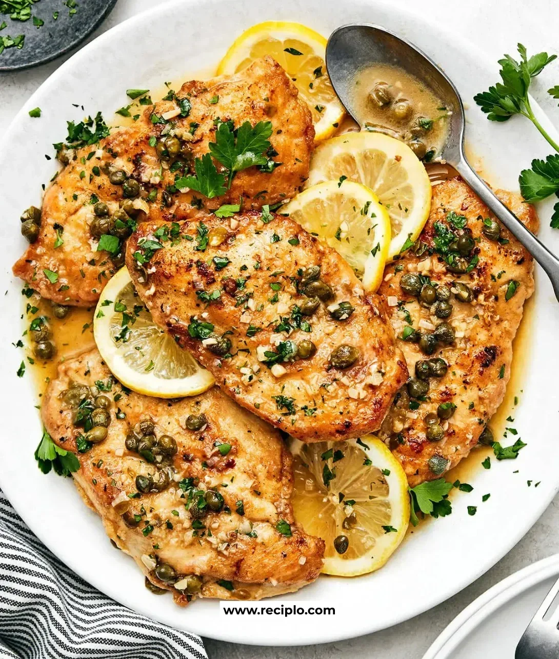 Delicious Chicken Piccata with lemon, capers, and herbs served on a plate
