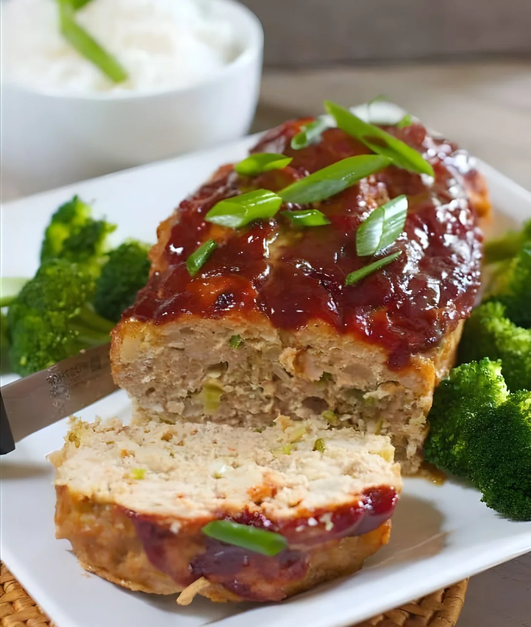 Asian style chicken meatloaf served with vegetables on a plate