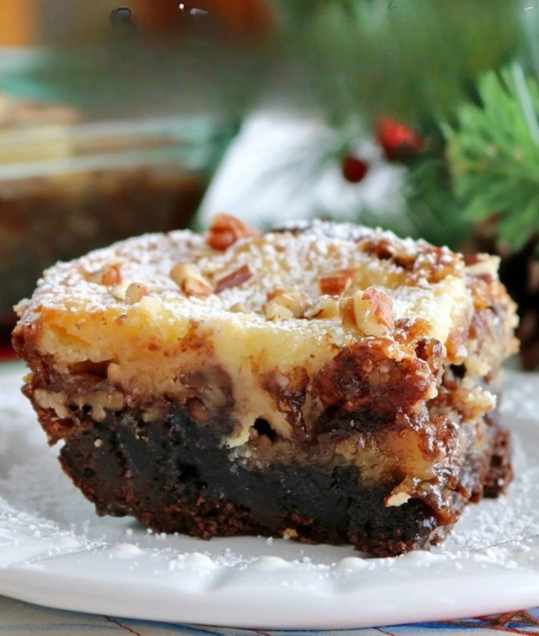 Delicious brownie pecan pie with layers of ooey gooey butter cake.