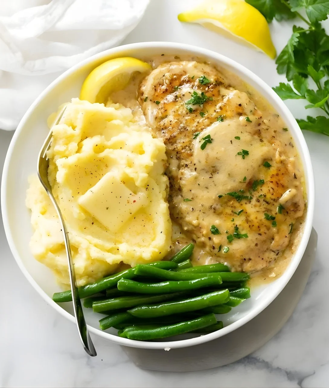 Delicious Chicken in White Wine Sauce plated with herbs and vegetables