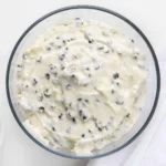 Creamy chocolate chip dip served with fresh fruits and cookies