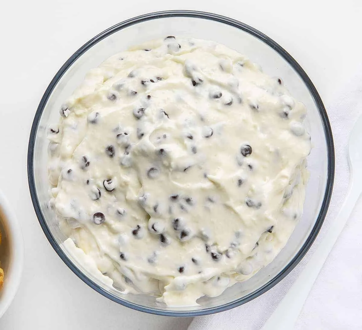 Creamy chocolate chip dip served with fresh fruits and cookies