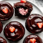 Delicious Chocolate Covered Strawberry Cupcakes topped with fresh strawberries