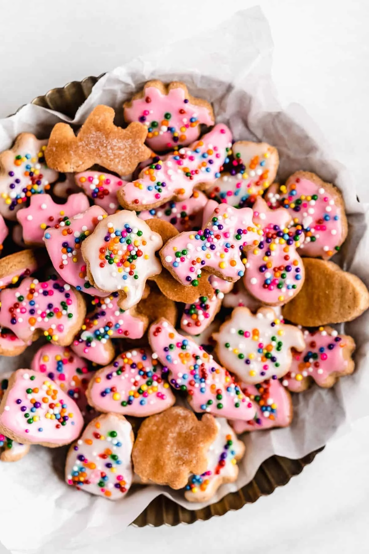 Homemade animal crackers on a wooden table, perfect for snacks.