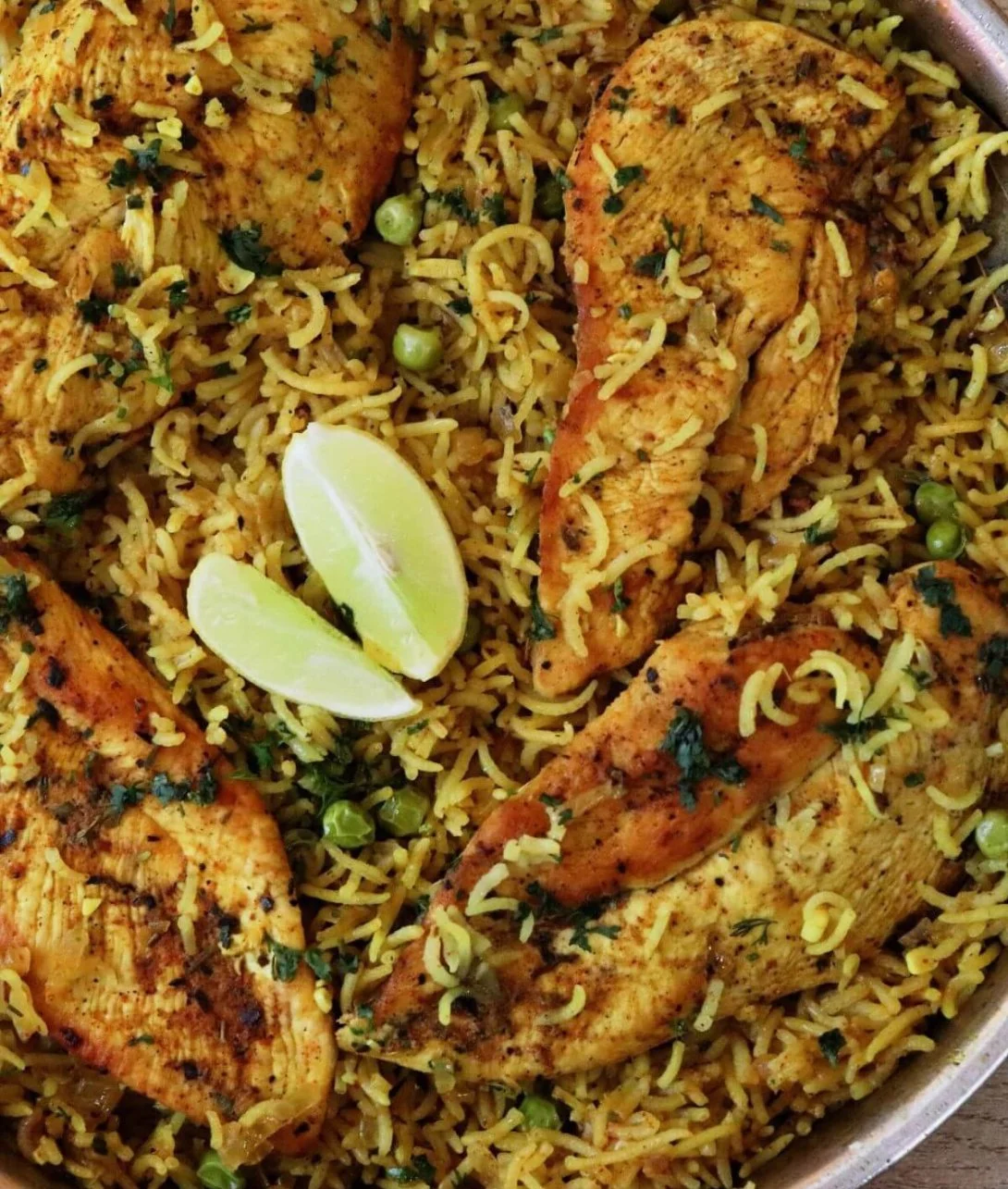 One Pan Mediterranean Chicken and Rice dish garnished with herbs and spices
