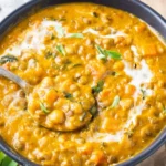 Delicious bowl of Pumpkin Curry with spices and herbs