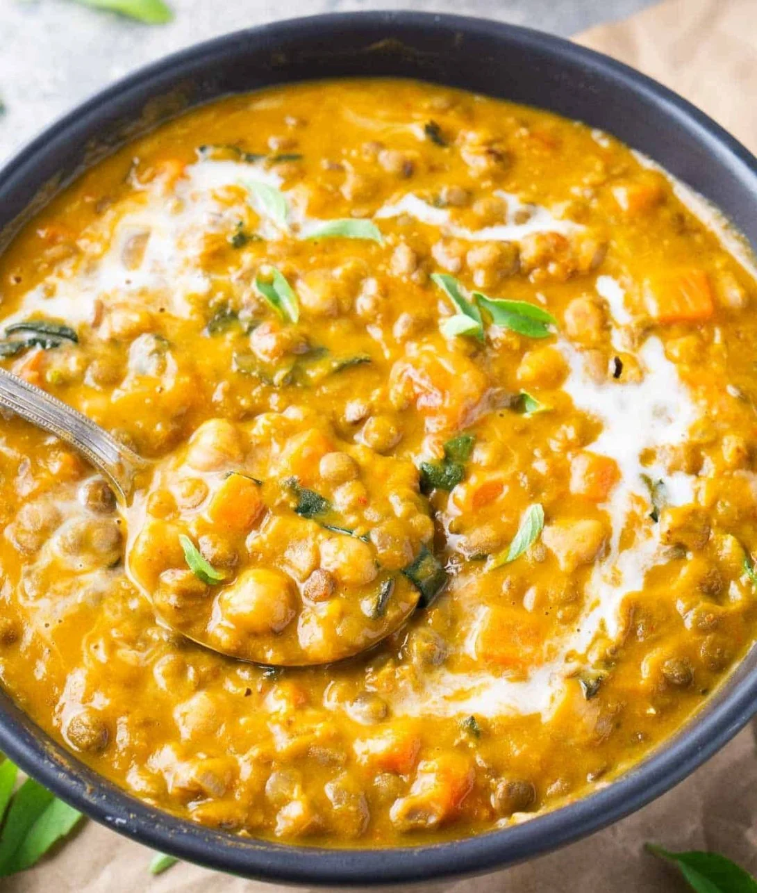 Delicious bowl of Pumpkin Curry with spices and herbs