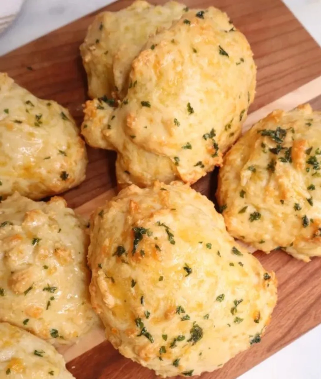 Flaky sourdough Greek yogurt cheddar biscuits fresh out of the oven.
