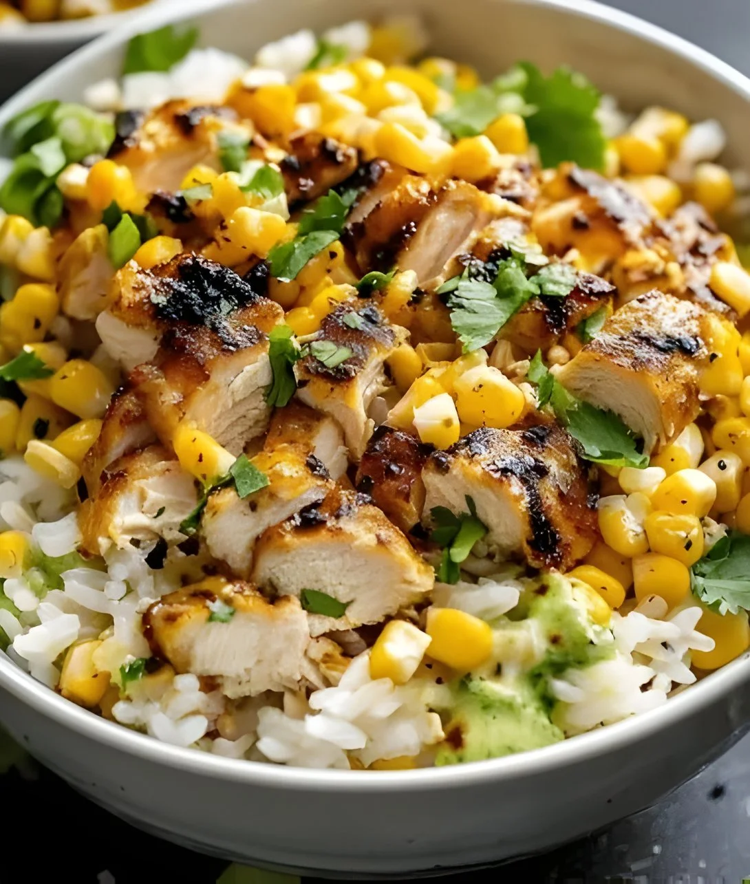 Delicious Street Corn Chicken Rice Bowl with tender chicken, corn, and rice.