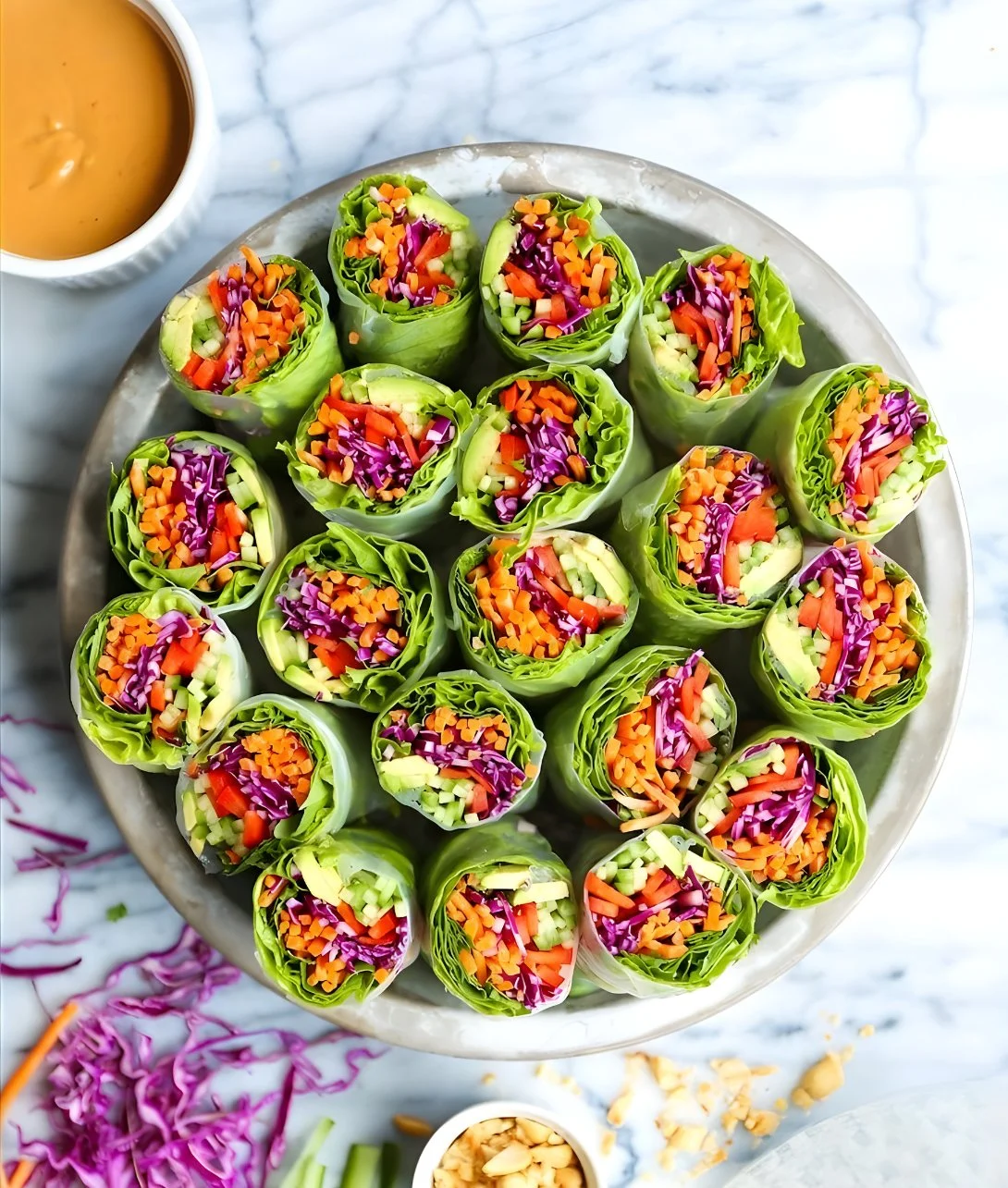 Vegetable spring rolls served with peanut sauce on a plate