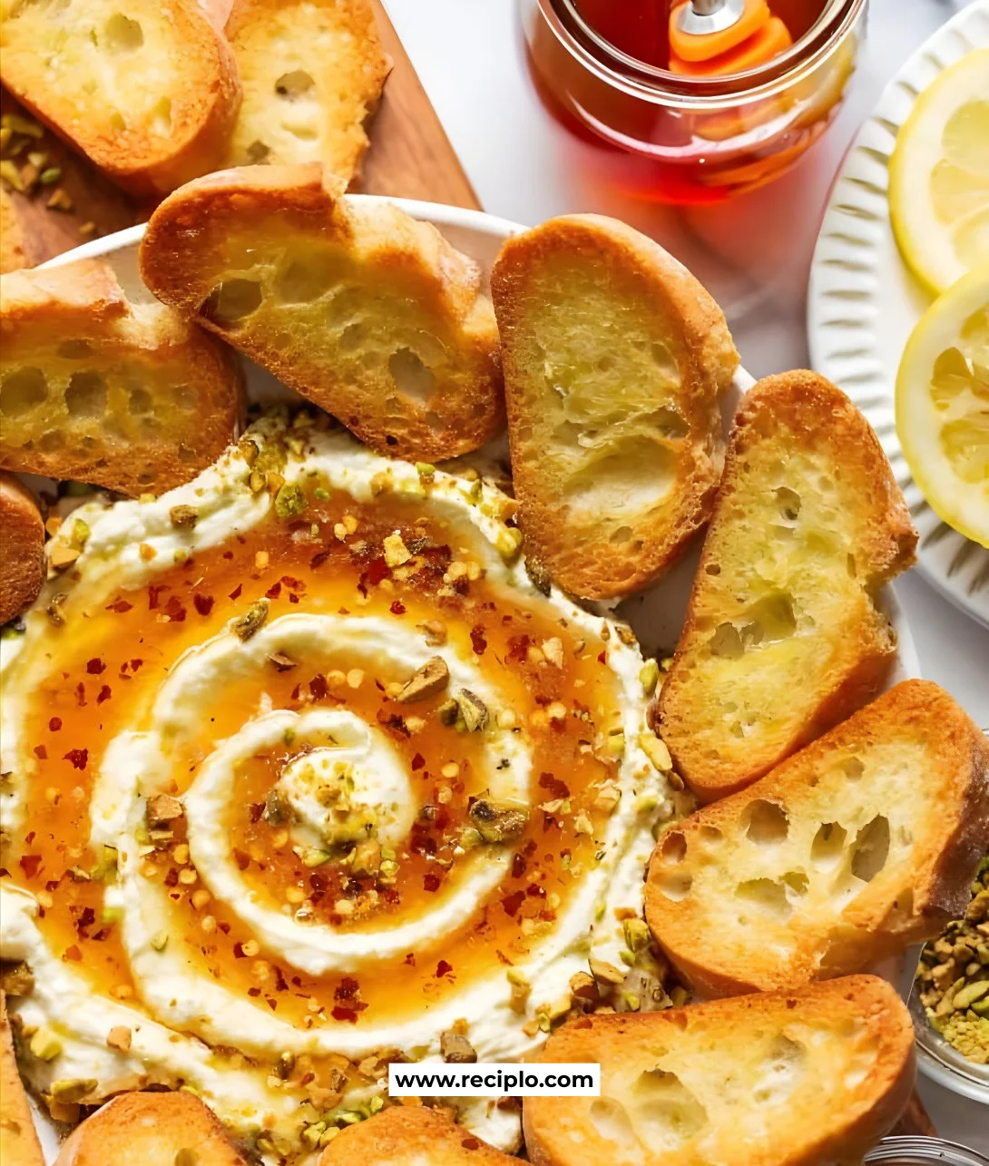 Delicious whipped feta cheese drizzled with honey, served as a gourmet dip.