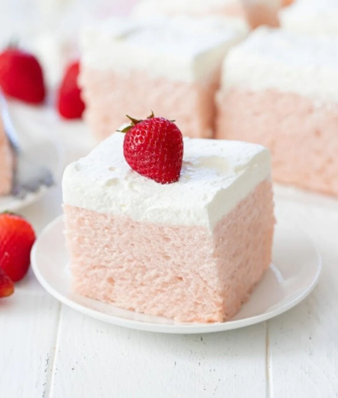 Delicious 3 Ingredient No Bake Strawberry Cloud Cake on a plate