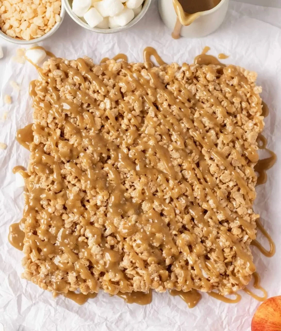 Apple Pie Rice Krispie Treats served on a plate with a sprinkle of cinnamon