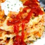 Bacon and cheese loaded hashbrown waffles served on a plate