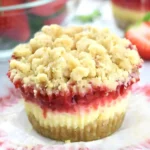 Baked strawberry cheesecake cupcakes with streusel crunch topping