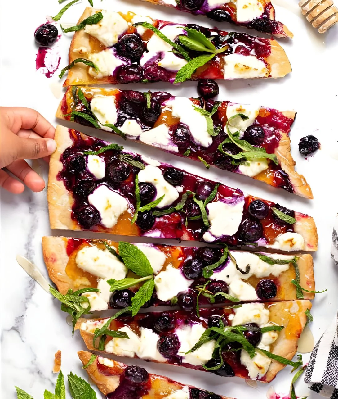 Blueberry flatbread topped with goat cheese and fresh blueberries