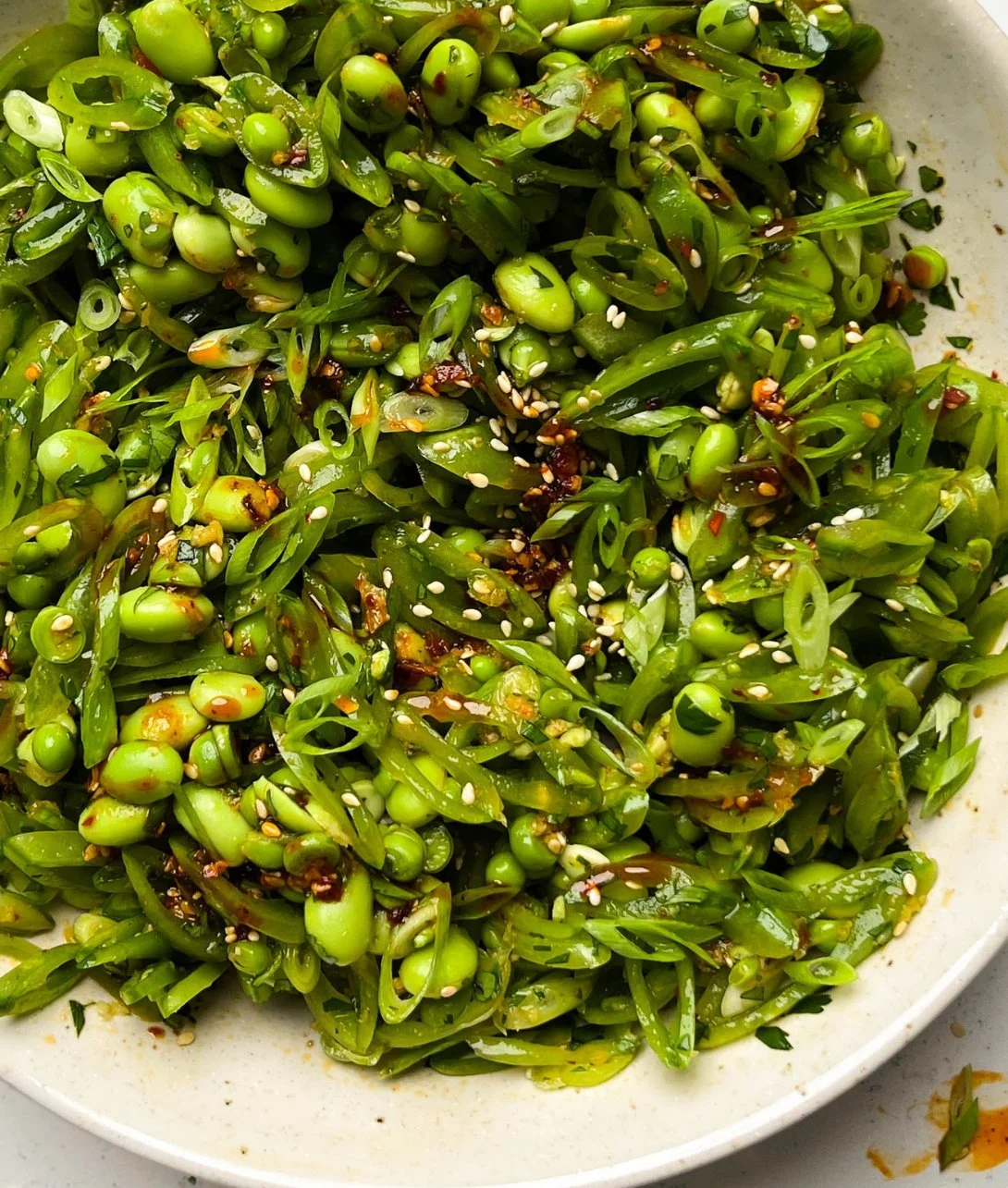 Chili Crisp Snap Pea Salad with vibrant colors and flavorful toppings