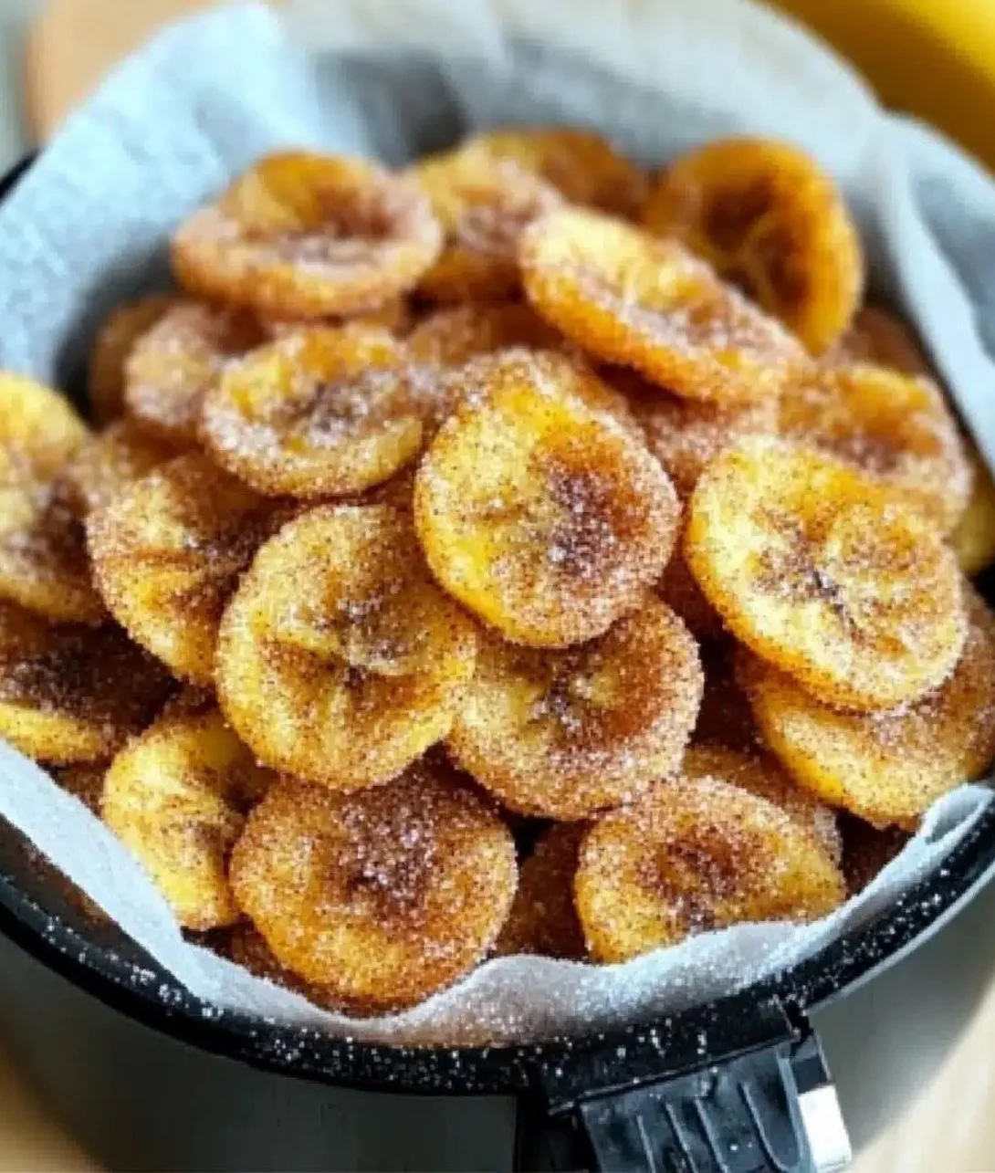 Cinnamon-sugar air fryer banana chips in a bowl, perfect for snacking