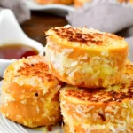 Coconut Stuffed French Toast topped with fresh fruit and syrup