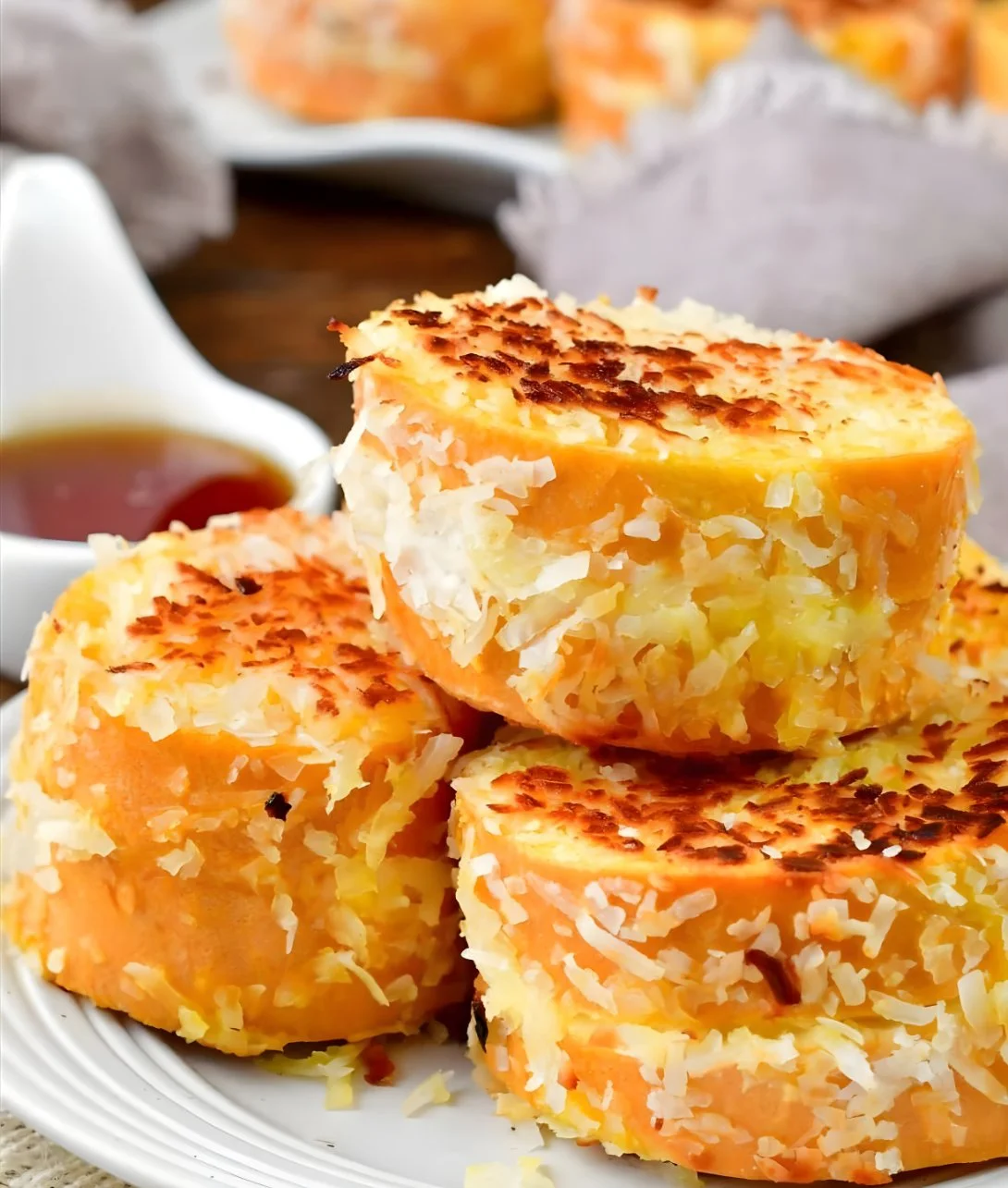 Coconut Stuffed French Toast topped with fresh fruit and syrup