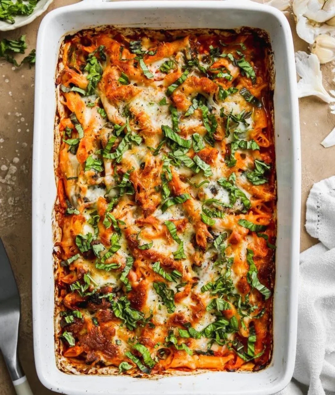 Baked cottage cheese pasta with vegetables and herbs in a dish