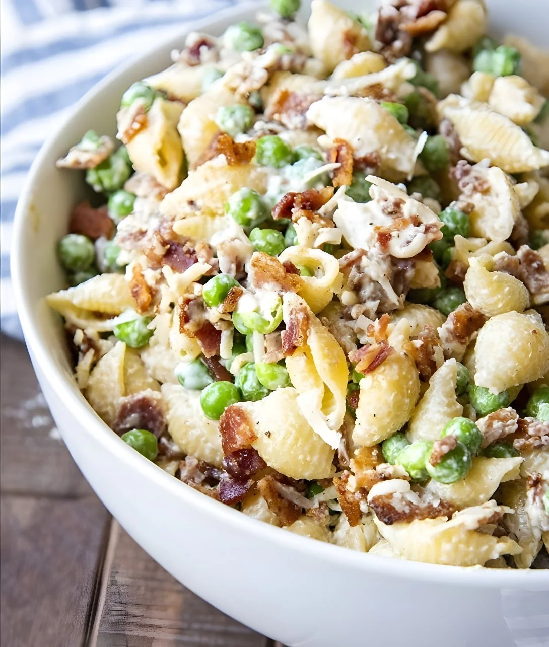 Delicious creamy pasta salad served in a bowl with colorful vegetables
