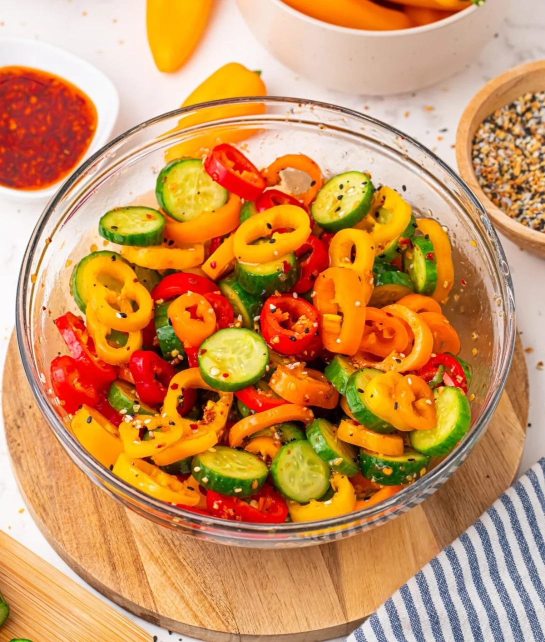 Cucumber salad with sweet peppers and herbs in a bowl