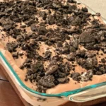 Delicious Chocolate Dirt Cake with gummy worms on top for a fun dessert