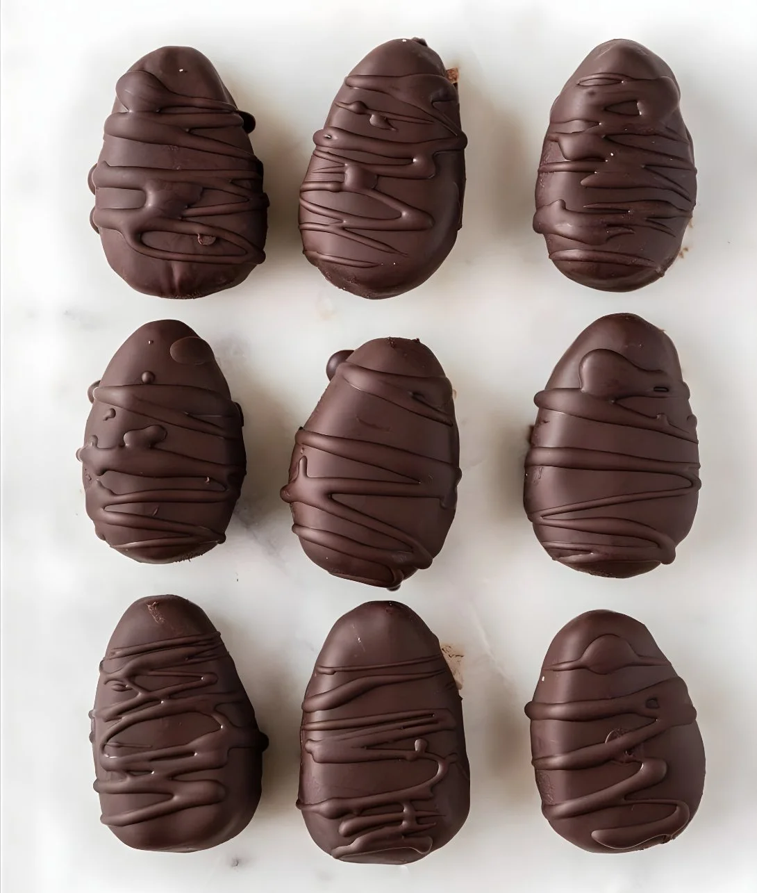 Homemade Easter Peanut Butter Eggs drizzled with chocolate