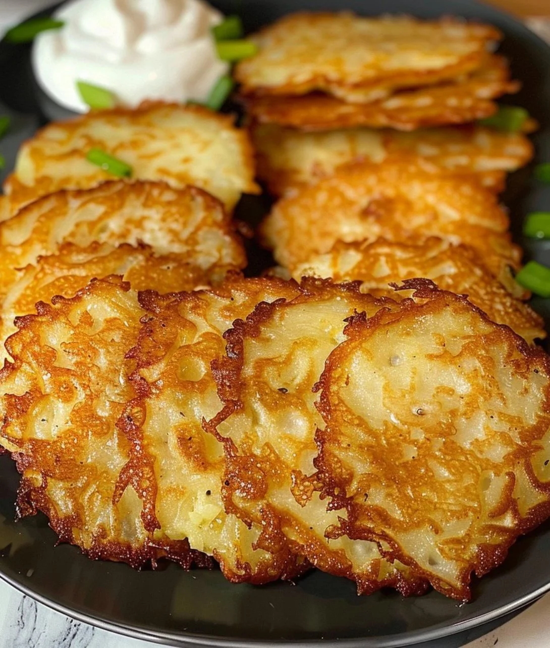 Delicious German potato pancakes served with applesauce and sour cream