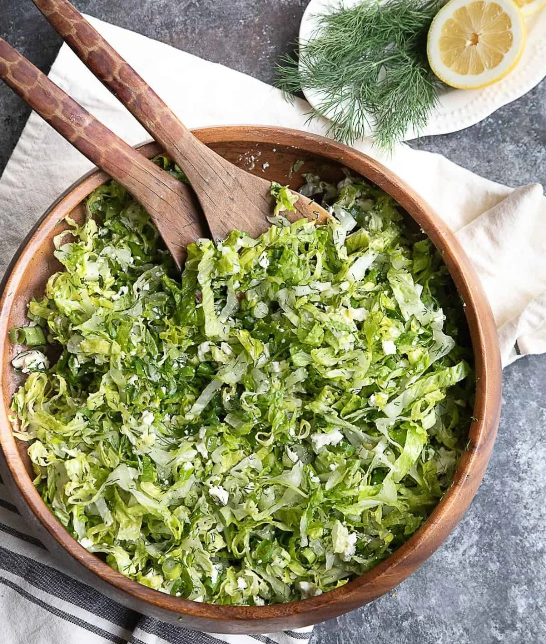 Bowl of Greek Lettuce Salad with cucumbers, tomatoes, olives, and feta cheese
