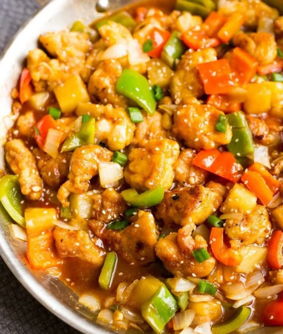 Healthy Paleo Whole30 sweet and sour chicken served with vibrant vegetables