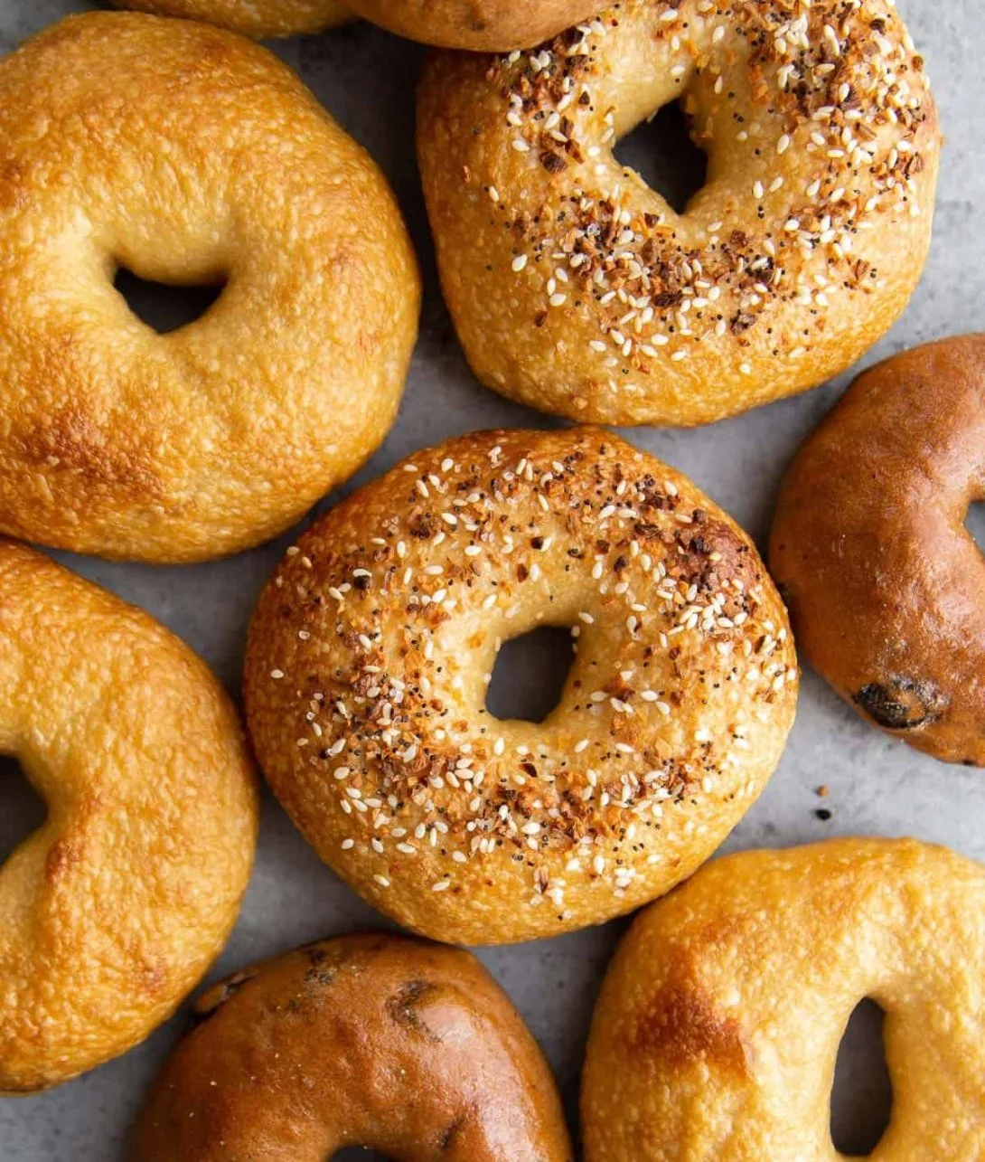 Freshly baked homemade bagels on a wooden table