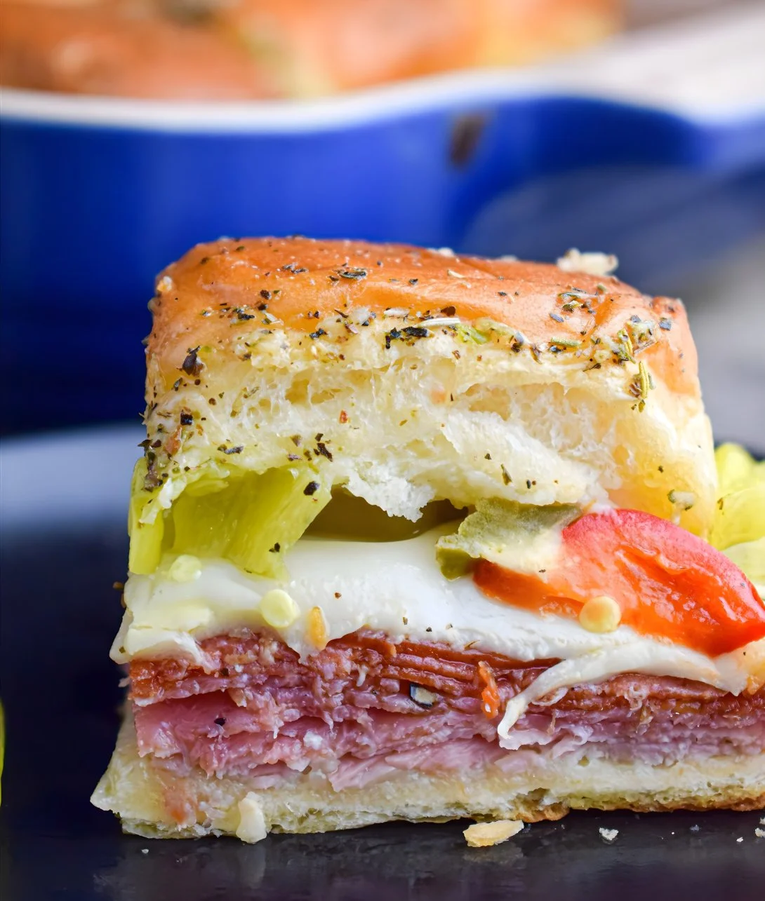 Hot Italian Sub Sliders with Italian meats and cheeses on a platter
