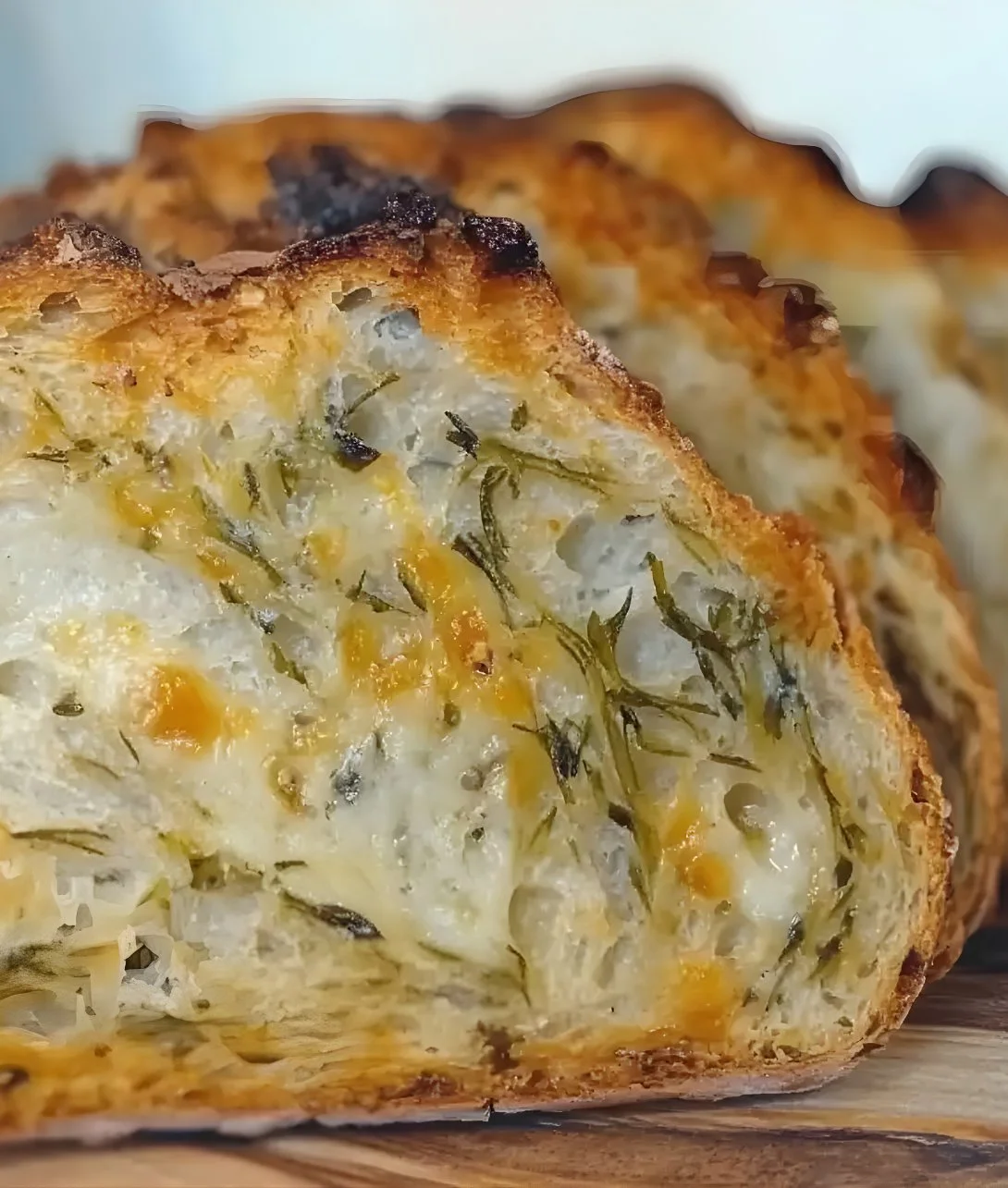 Freshly baked Italian herbs and cheese bread with golden crust