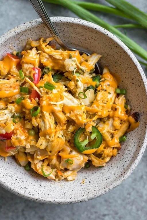 Delicious Jalapeño Buffalo Chicken Casserole topped with cheese and jalapeños.