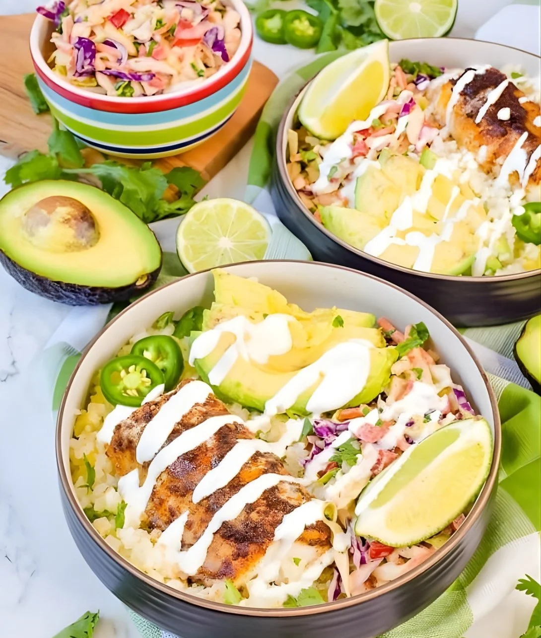 Delicious low carb fish taco bowls garnished with fresh toppings