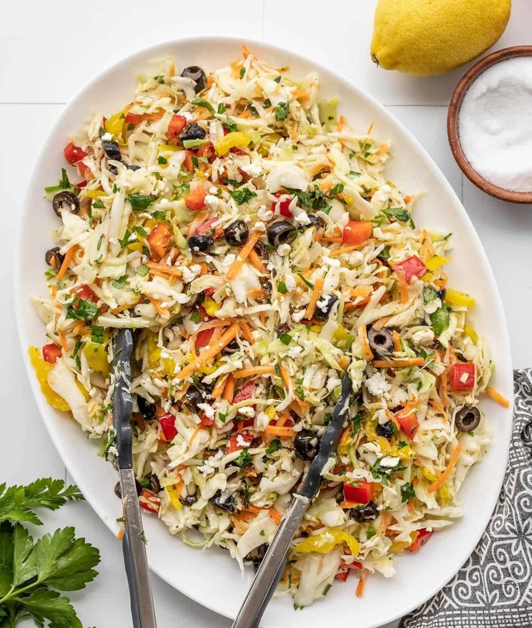 Bowl of Mediterranean Coleslaw with fresh vegetables and herbs