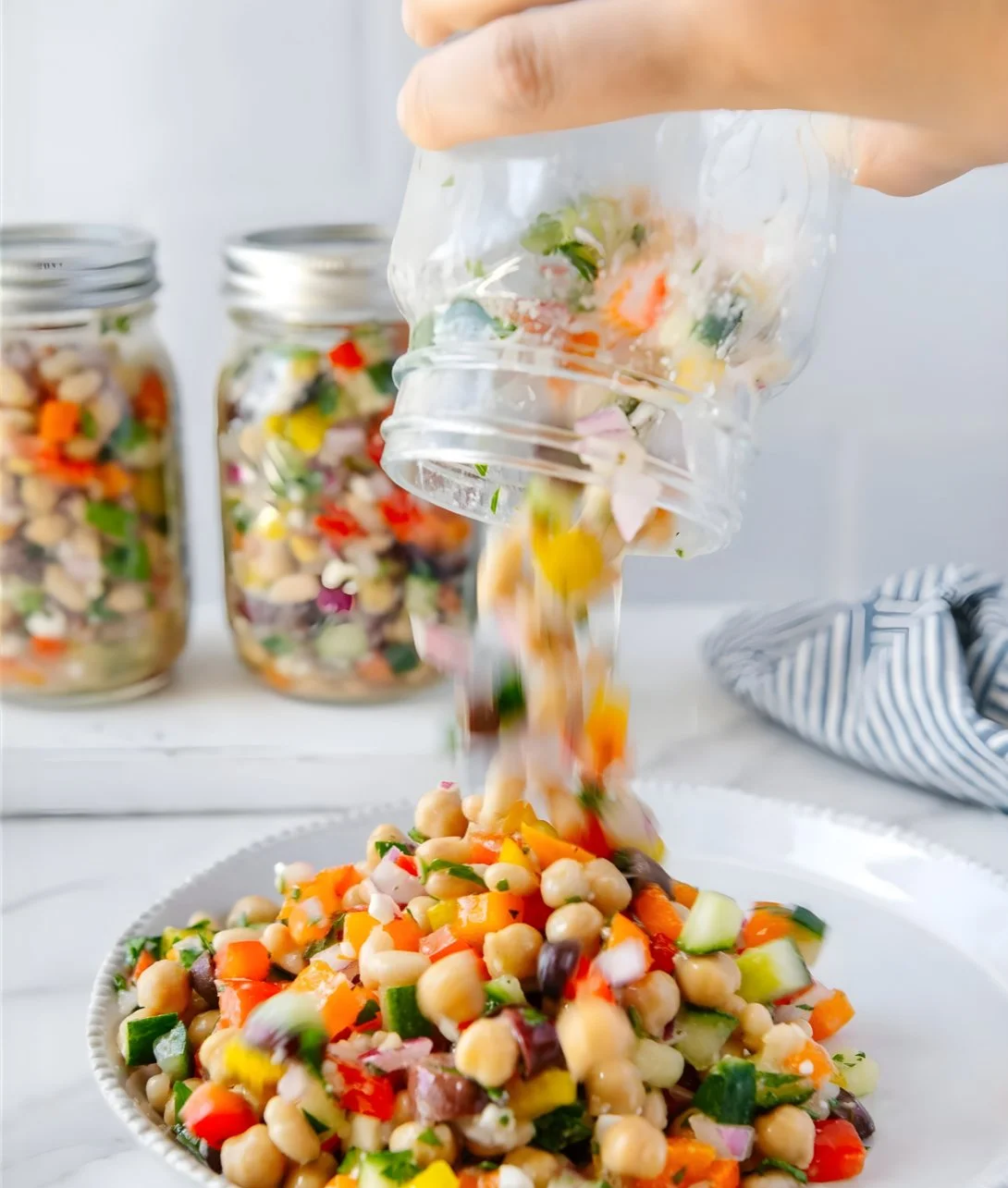 Mediterranean dense bean salad with colorful vegetables and herbs