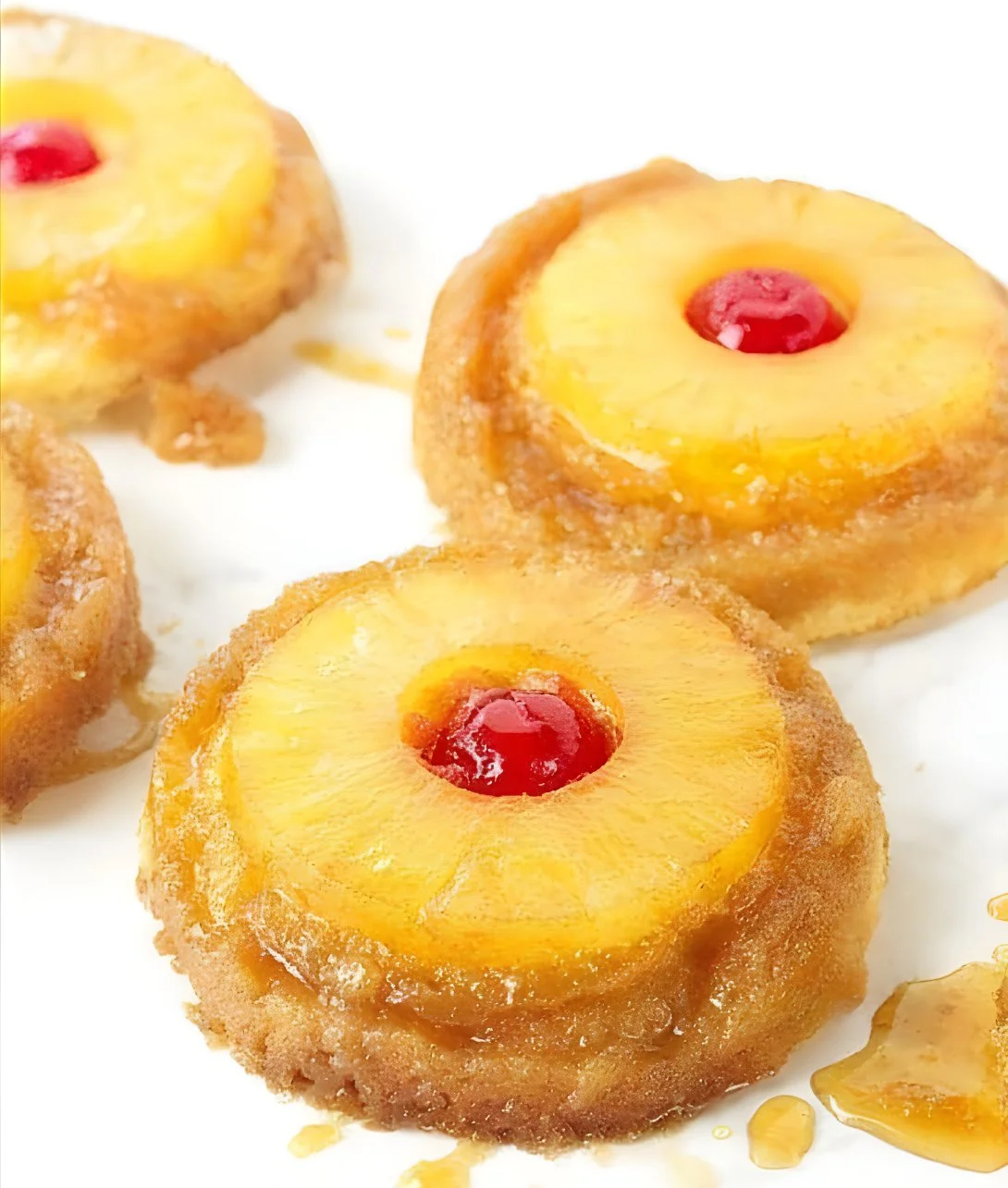 Pineapple Upside Down Sugar Cookies on a plate with colorful garnishes