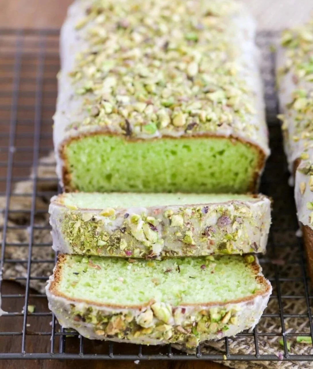 Freshly baked pistachio bread loaf with nuts and herbs