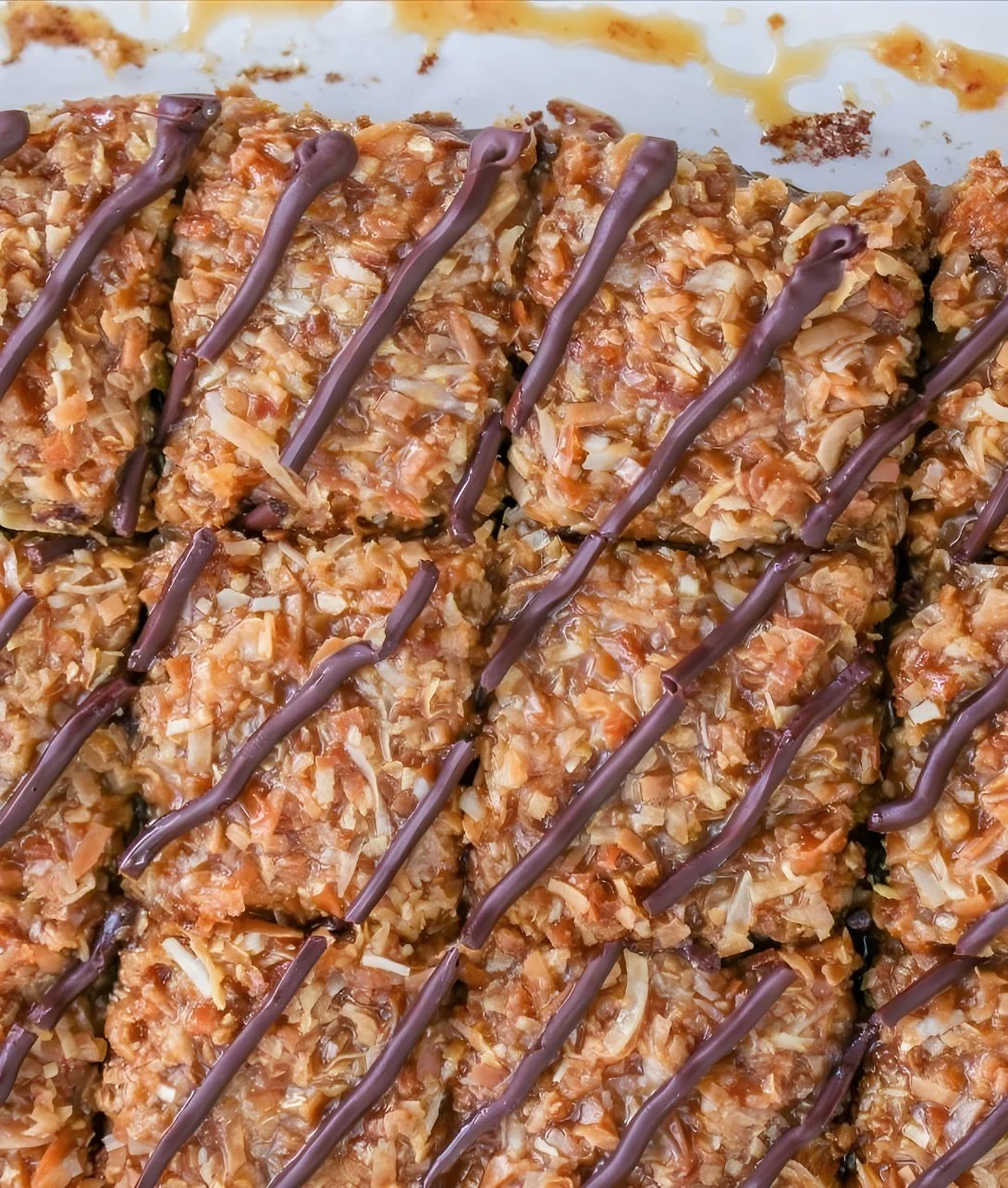 Decadent Samoa Brownies topped with coconut and caramel drizzle