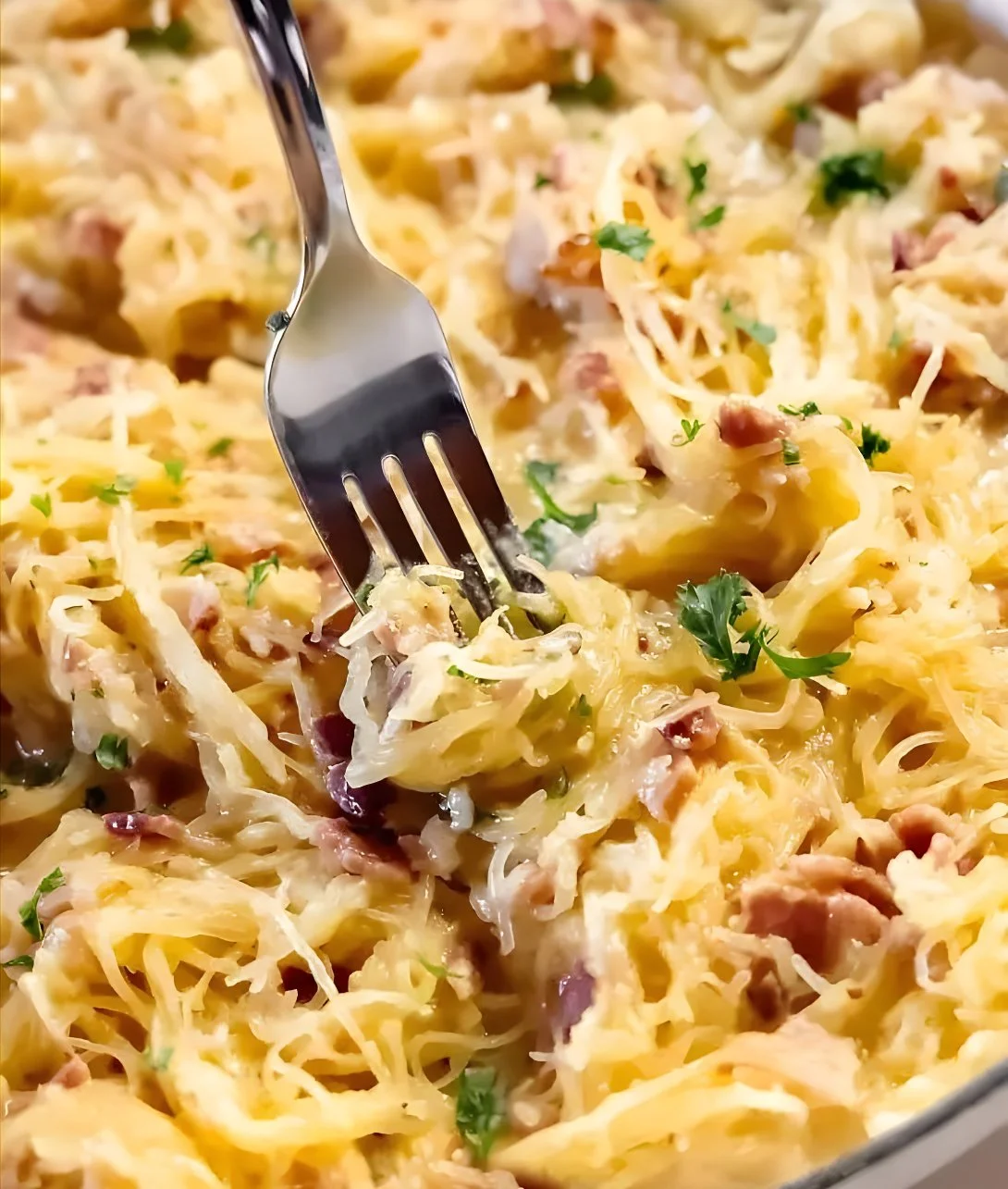 Delicious spaghetti squash carbonara served in a bowl with parsley garnish