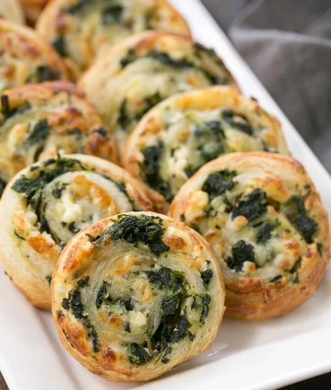 Delicious Spinach Feta Pinwheels served on a stylish platter