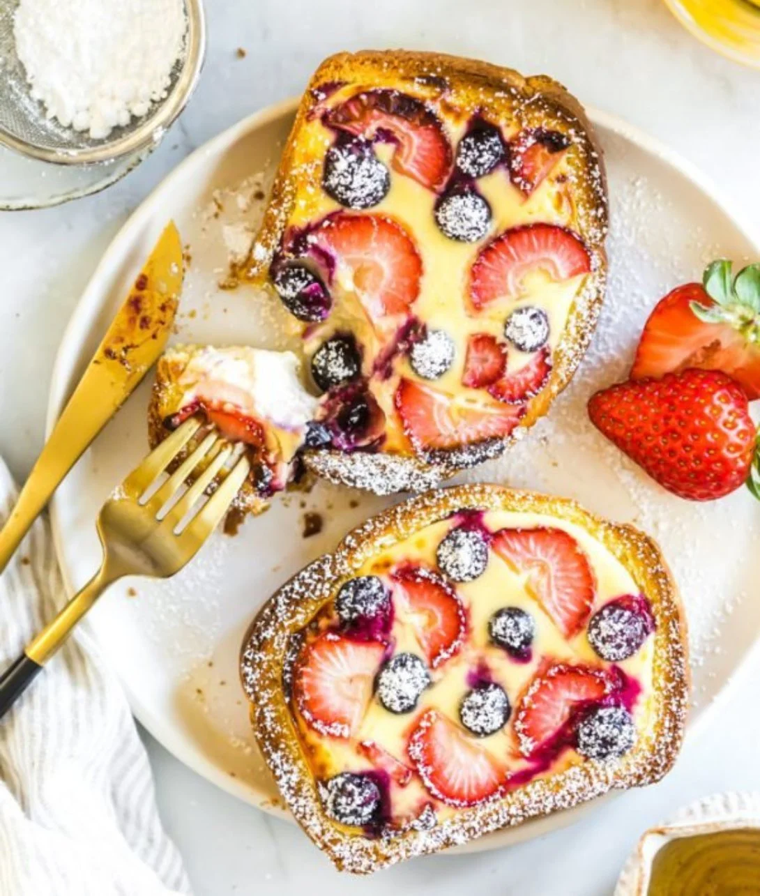 Air Fryer Yogurt Custard Toast topped with fruits and served on a plate