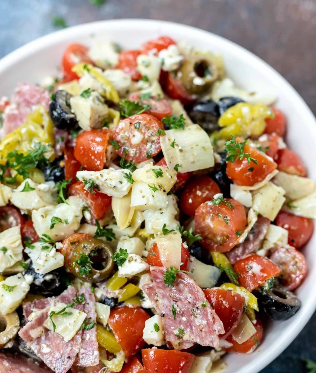Colorful Antipasto Salad with fresh vegetables, meats, and cheeses