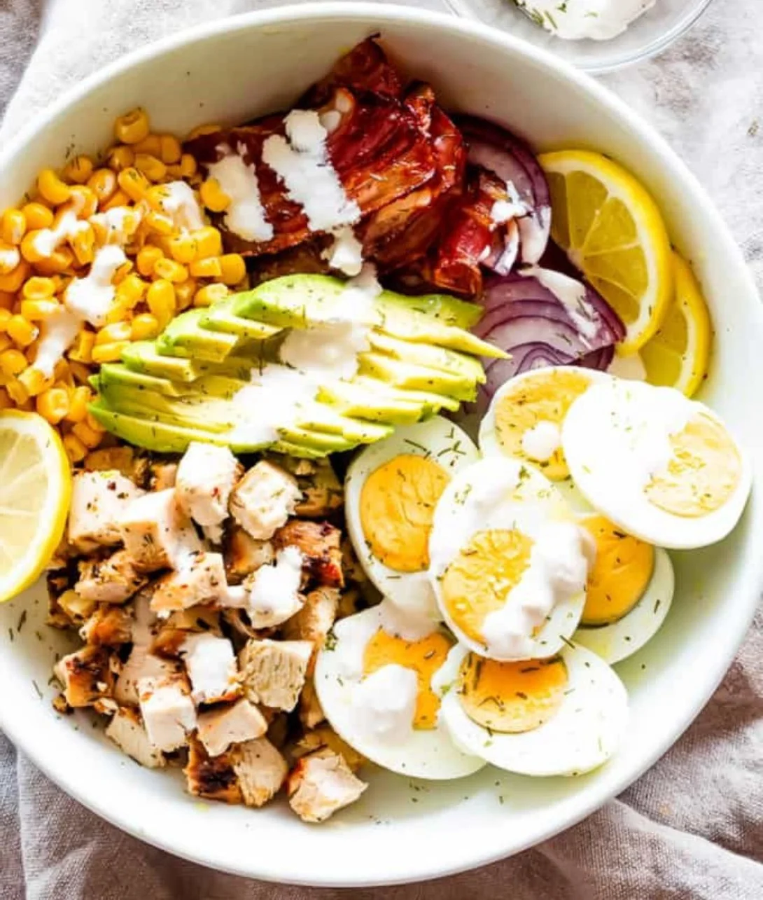 Avocado chicken egg salad with fresh ingredients and vibrant colors