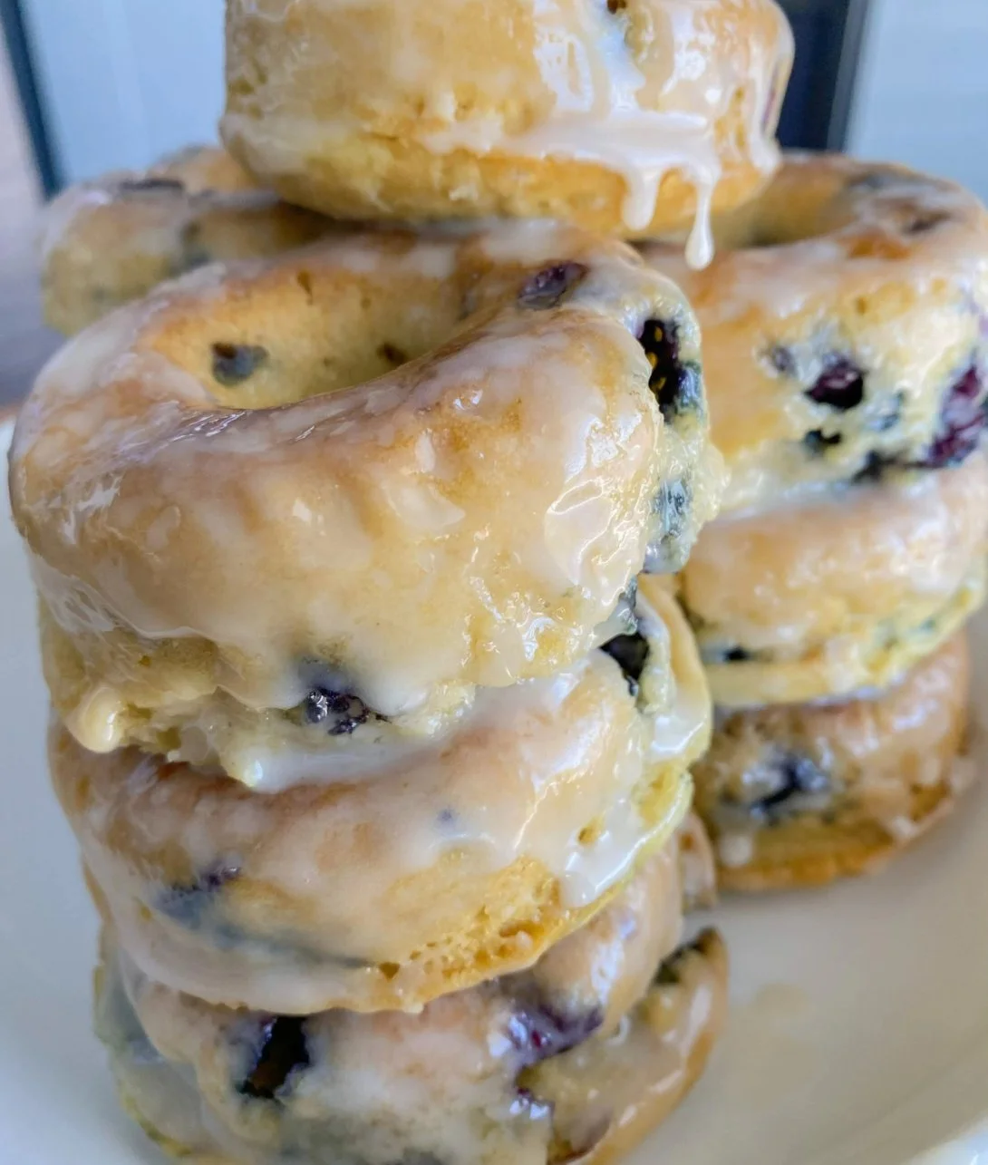 Baked blueberry donuts topped with a sweet glaze