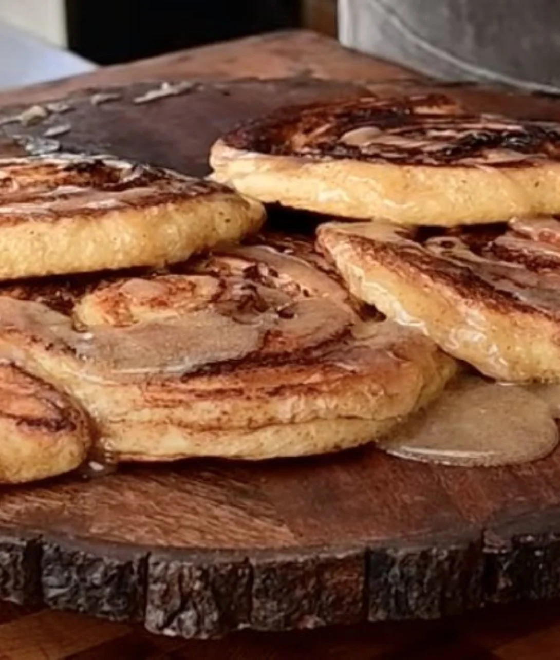 Delicious homemade Blackstone cinnamon rolls topped with icing