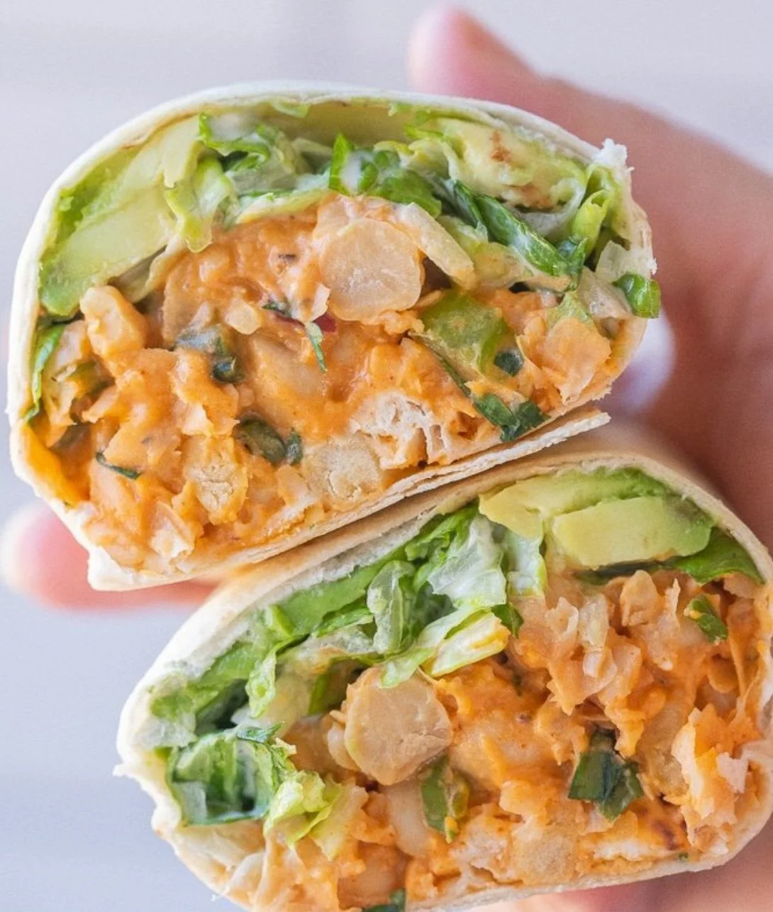 Delicious Buffalo Chickpea Wraps served on a plate with vegetables